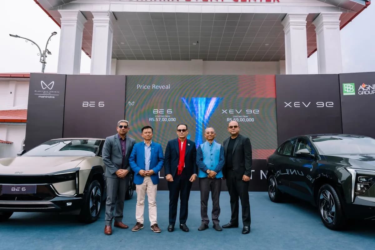 Cabinet Shrestha, far right, with four others between a BE 6 and an XEV 9e at their price reveal